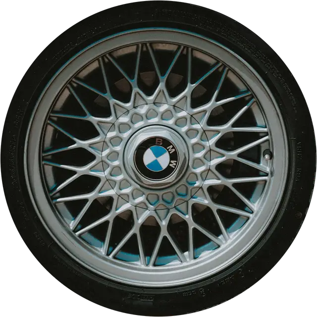 A classic multi-spoke alloy wheel with its tyre, spinning